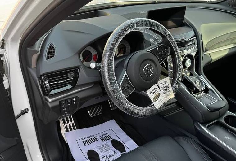 Acura RDX black leather cabin with protective wheel cover
